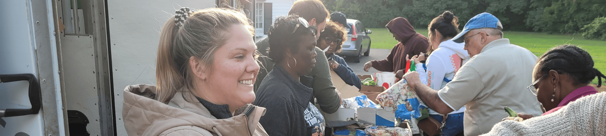 volunteers smiling at food pantry